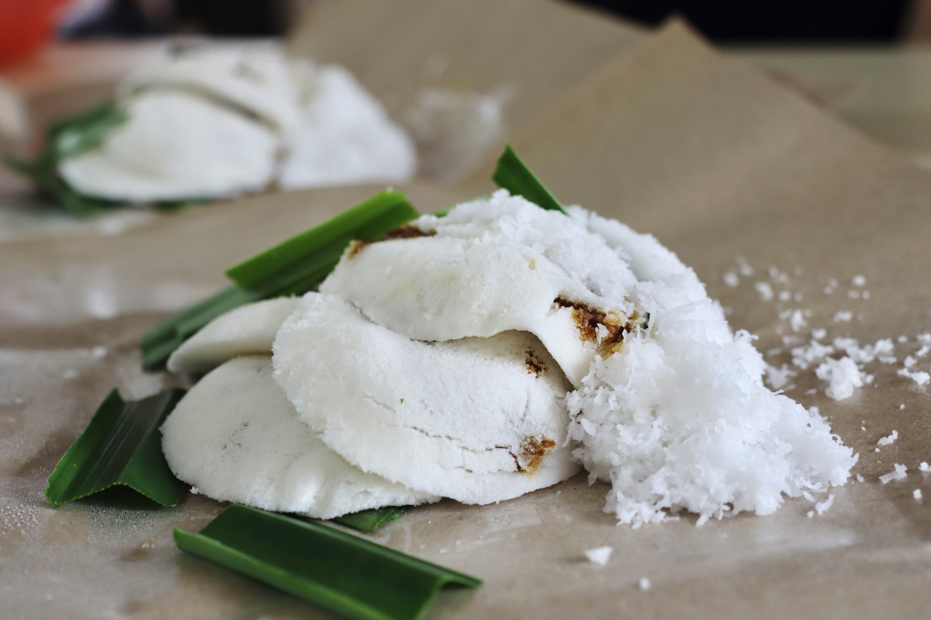 Putu piring - steamed rice flour with caramelised palm sugar, pandan leaves and grated coconut